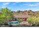 A beautiful aerial view showcases a private pool with scenic mountain views at 13945 E Gail Rd, Scottsdale, AZ 85259