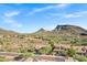 Beautiful aerial view of homes nestled amongst desert terrain and scenic mountain views in a vibrant community at 13945 E Gail Rd, Scottsdale, AZ 85259