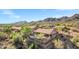 Beautiful aerial view of desert homes nestled in a vibrant community near scenic mountain views at 13945 E Gail Rd, Scottsdale, AZ 85259