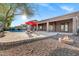 Private backyard pool with a red umbrella and fire pit lounge area at 13945 E Gail Rd, Scottsdale, AZ 85259