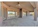 Large covered patio featuring a ceiling fan with outdoor living and mountain views at 13945 E Gail Rd, Scottsdale, AZ 85259