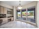 Bright dining space with outdoor views, built-in desk and shelving at 13945 E Gail Rd, Scottsdale, AZ 85259