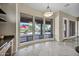 Dining Area with pool view, light fixture, and neutral paint at 13945 E Gail Rd, Scottsdale, AZ 85259