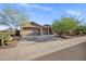 A pleasing single-story home showcasing a three-car garage and desert landscaping at 13945 E Gail Rd, Scottsdale, AZ 85259
