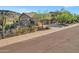 Charming home with desert landscaping, mature trees, and three-car garage at 13945 E Gail Rd, Scottsdale, AZ 85259