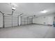 Spacious three-car garage with ample lighting and neutral paint at 13945 E Gail Rd, Scottsdale, AZ 85259