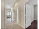 Hallway with tile floors and doorways leading to various rooms at 13945 E Gail Rd, Scottsdale, AZ 85259