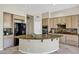 Spacious kitchen features granite counters, island, and stainless steel appliances at 13945 E Gail Rd, Scottsdale, AZ 85259