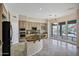 Open kitchen featuring a granite island, stainless appliances, and ample natural light at 13945 E Gail Rd, Scottsdale, AZ 85259