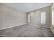 Spacious living room with tile flooring and natural light from the windows at 13945 E Gail Rd, Scottsdale, AZ 85259