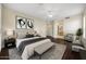 Spacious main bedroom features a sitting area, en-suite bath, and ample natural light at 13945 E Gail Rd, Scottsdale, AZ 85259