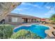 Beautiful backyard pool featuring scenic mountain views, chairs and umbrella at 13945 E Gail Rd, Scottsdale, AZ 85259