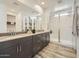 Contemporary bathroom with double vanity, walk-in shower with glass doors, and modern fixtures at 1415 W J Waltz Way, Apache Junction, AZ 85120