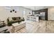 Inviting living room featuring a comfortable sofa, stylish decor, and an open layout to the kitchen at 1415 W J Waltz Way, Apache Junction, AZ 85120