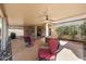 Covered patio with ample seating and outdoor dining space, great for entertaining guests at 14819 W Lupine Ln, Surprise, AZ 85374