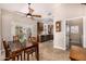 Inviting dining area with a ceiling fan, table, and easy access to the kitchen at 14819 W Lupine Ln, Surprise, AZ 85374