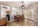 The dining room connects to the living room and offers outdoor views at 14819 W Lupine Ln, Surprise, AZ 85374