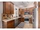 Well-equipped kitchen with stainless steel appliances, granite counters, and ample cabinetry at 14819 W Lupine Ln, Surprise, AZ 85374
