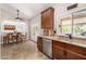 Kitchen boasts granite countertops, stainless appliances, and a view to the dining area at 14819 W Lupine Ln, Surprise, AZ 85374