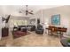 Spacious living room featuring vaulted ceilings and ample natural light and tiled floor at 14819 W Lupine Ln, Surprise, AZ 85374
