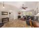 Bright and spacious living room with vaulted ceilings and plantation shutters at 14819 W Lupine Ln, Surprise, AZ 85374