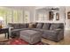 Comfortable living room with a plush sectional sofa and view of the kitchen at 14819 W Lupine Ln, Surprise, AZ 85374