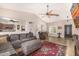 Spacious living room features a ceiling fan, tile floors, and comfortable seating at 14819 W Lupine Ln, Surprise, AZ 85374