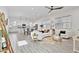 An open concept living room and kitchen with tile flooring at 15718 W Polk St, Goodyear, AZ 85338