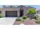 Charming home with a well-maintained landscaped front yard, a two-car garage, and a welcoming entrance at 16417 W Piccadilly Rd, Goodyear, AZ 85395