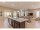 Spacious open concept layout, seamlessly connecting the kitchen island to the living space at 16417 W Piccadilly Rd, Goodyear, AZ 85395