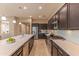 Stylish kitchen equipped with stainless steel appliances, ample counter space, and modern lighting fixtures at 16417 W Piccadilly Rd, Goodyear, AZ 85395