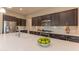 Gourmet kitchen featuring a large island with a sink, perfect for meal prep and entertaining guests at 16417 W Piccadilly Rd, Goodyear, AZ 85395