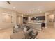 Open-concept living area with a view of the kitchen island and modern finishes, creating a seamless living space at 16417 W Piccadilly Rd, Goodyear, AZ 85395