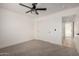 Neutral bedroom featuring carpet floors, sliding closet doors and a ceiling fan at 16627 N Slate Ln, Maricopa, AZ 85139