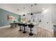 Bright, open kitchen and dining area with island seating and stainless steel appliances at 16627 N Slate Ln, Maricopa, AZ 85139