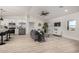 Stylish living area boasts sleek furniture, a modern ceiling fan, and ample natural light at 16627 N Slate Ln, Maricopa, AZ 85139