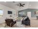 Inviting living space with a comfortable sofa, a TV, and a neutral color palette at 16627 N Slate Ln, Maricopa, AZ 85139