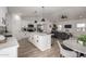 Open floor plan with modern kitchen, living and dining areas, perfect for entertaining and everyday living at 16627 N Slate Ln, Maricopa, AZ 85139
