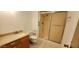 Bathroom featuring a vanity, toilet, and glass-enclosed shower at 17056 N 107Th Ave, Sun City, AZ 85373