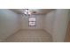 Bedroom with tile floor, ceiling fan and a window with blinds at 17056 N 107Th Ave, Sun City, AZ 85373
