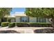 Charming single-story home featuring lush landscaping and secure window coverings at 17056 N 107Th Ave, Sun City, AZ 85373