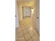 Hallway featuring tile floors that extend into other rooms at 17056 N 107Th Ave, Sun City, AZ 85373