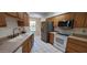 Well-equipped kitchen with modern appliances, wood cabinetry, and bright natural light at 17056 N 107Th Ave, Sun City, AZ 85373