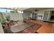 Cozy outdoor patio with tile flooring and a fire pit at 17056 N 107Th Ave, Sun City, AZ 85373