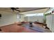 Covered patio featuring tile floors, brick accents, and a small fire pit at 17056 N 107Th Ave, Sun City, AZ 85373