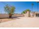The fenced backyard features a large patio area that provides ample space for seating and entertaining at 1811 W Roma Ave, Phoenix, AZ 85015