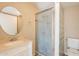 Bathroom featuring a vanity, toilet, and a shower with glass door at 1811 W Roma Ave, Phoenix, AZ 85015