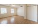 Comfortable bedroom with tile flooring, closet, and two windows offering ample natural light at 1811 W Roma Ave, Phoenix, AZ 85015