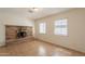 Inviting living room with a brick fireplace and natural lighting, ideal for entertaining at 1811 W Roma Ave, Phoenix, AZ 85015