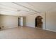 Open-concept living room with an open doorway and tile flooring at 1811 W Roma Ave, Phoenix, AZ 85015